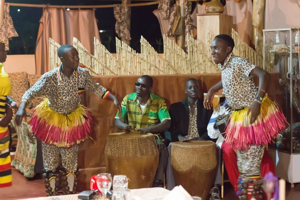 Traditional cultural performance in Uganda highlighting meaningful travel and community connection during a safari experience